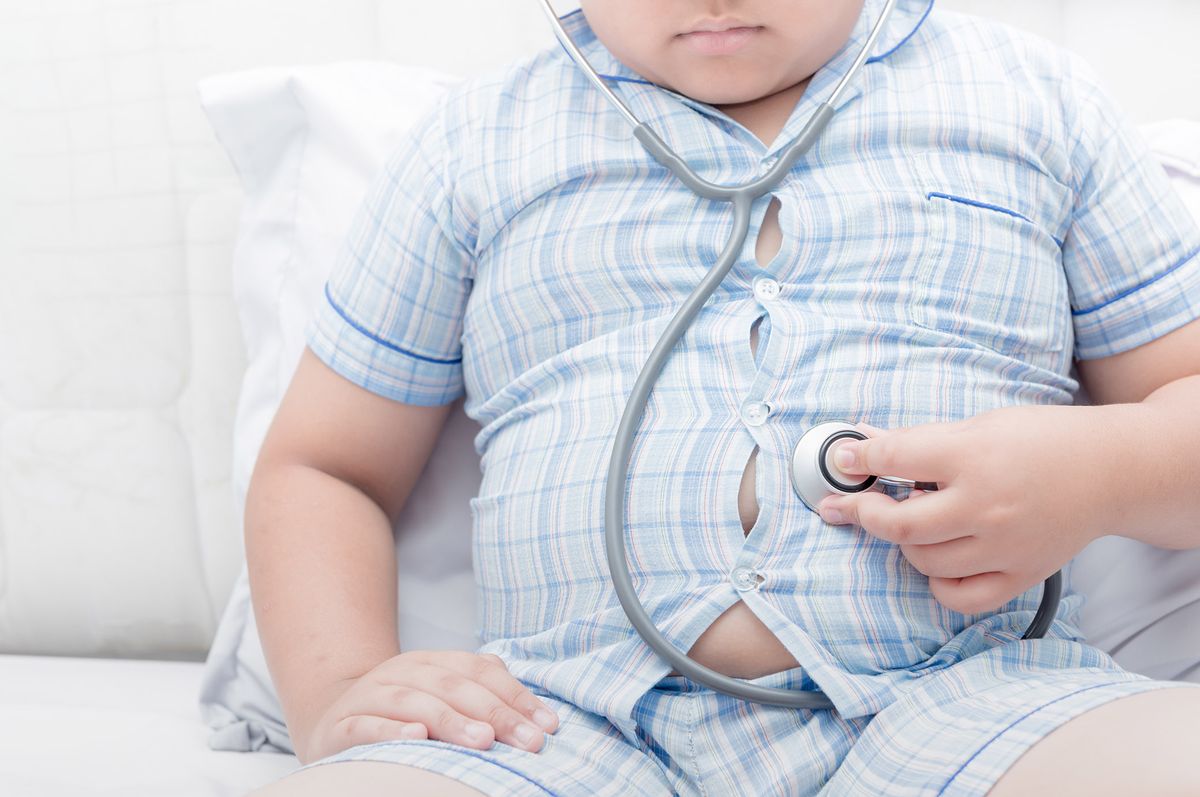 Obese,Fat,Boy,Check,Stomach,By,Stethoscope.,Tight,Shirt,Of