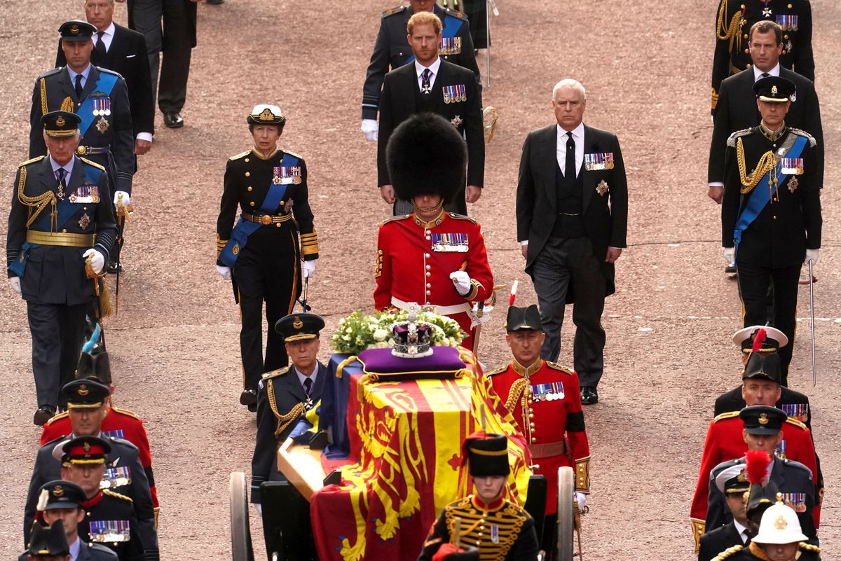 Britain's King Charles III, Britain's Princess Anne, Princess Royal, Britain's Prince Andrew, Duke of York, Britain's Prince Edward, Earl of Wessex walk behind the coffin of Queen Elizabeth II, adorned with a Royal Standard and the Imperial State Crown and pulled by a Gun Carriage of The King's Troop Royal Horse Artillery, during a procession from Buckingham Palace to the Palace of Westminster, in London on September 14, 2022. - Queen Elizabeth II will lie in state in Westminster Hall inside the Palace of Westminster, from Wednesday until a few hours before her funeral on Monday, with huge queues expected to file past her coffin to pay their respects.