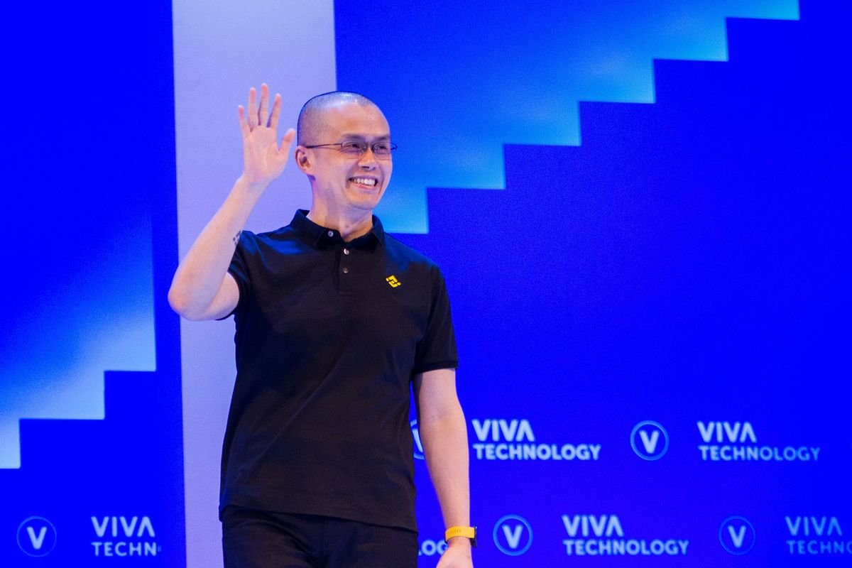 1241345491 Changpeng Zhao, founder and chief executive officer of Binance, waves as he arrives on stage for a panel session on the second day at the Vivatech Conference in Paris, France, on Thursday, June 16, 2022. The conference, also known as VivaTech, runs though to June 18. Photographer: Nathan Laine/Bloomberg via Getty Images