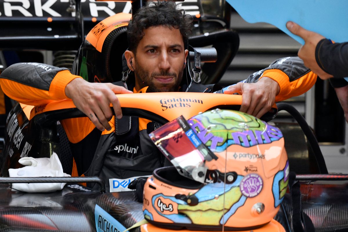 McLaren's Australian driver Daniel Ricciardo sits in his car ahead of the qualifying session for the Belgian Formula One Grand Prix at Spa-Francorchamps racetrack in Spa, on August 27, 2022. (Photo by Geert Vanden Wijngaert / POOL / AFP)