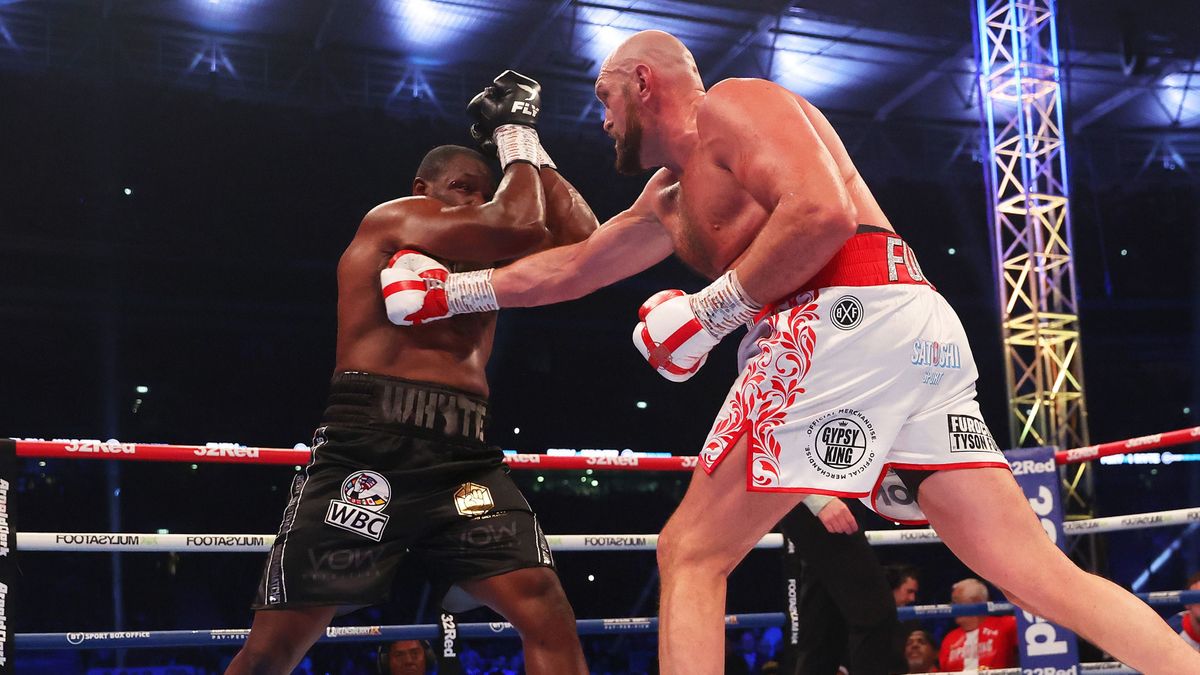 Tyson Fury v Dillian Whyte - Heavyweight Fight, LONDON, ENGLAND - APRIL 23: Tyson Fury punches Dillian Whyte during the WBC World Heavyweight Title Fight between Tyson Fury and Dillian Whyte at Wembley Stadium on April 23, 2022 in London, England. (Photo by Julian Finney/Getty Images)