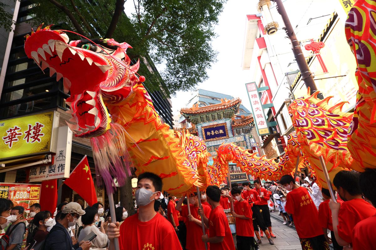 Celebration in China Town, A dragon dances to celebrate National Day of the People's Republic of China and 50th anniversary of normalization of Japan-China at China Town in Yokohama, Kanagawa Prefecture on Oct. 1, 2022. ( The Yomiuri Shimbun ) (Photo by Yuki Kurose / Yomiuri / The Yomiuri Shimbun via AFP) Celebration in China Town