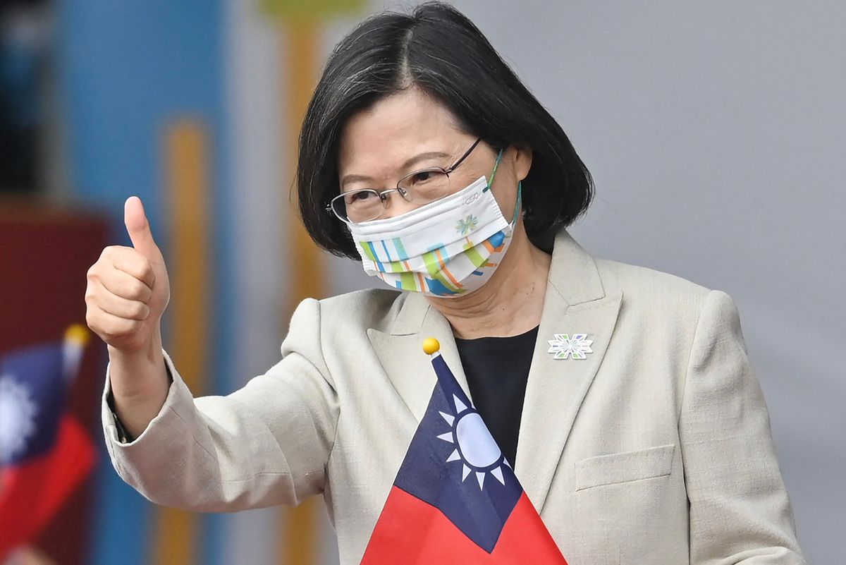 Taiwan's President Tsai Ing-wen gives a thumbs-up sign as she attends a ceremony to mark the island's National Day in front of the Presidential Office in Taipei on October 10, 2022.