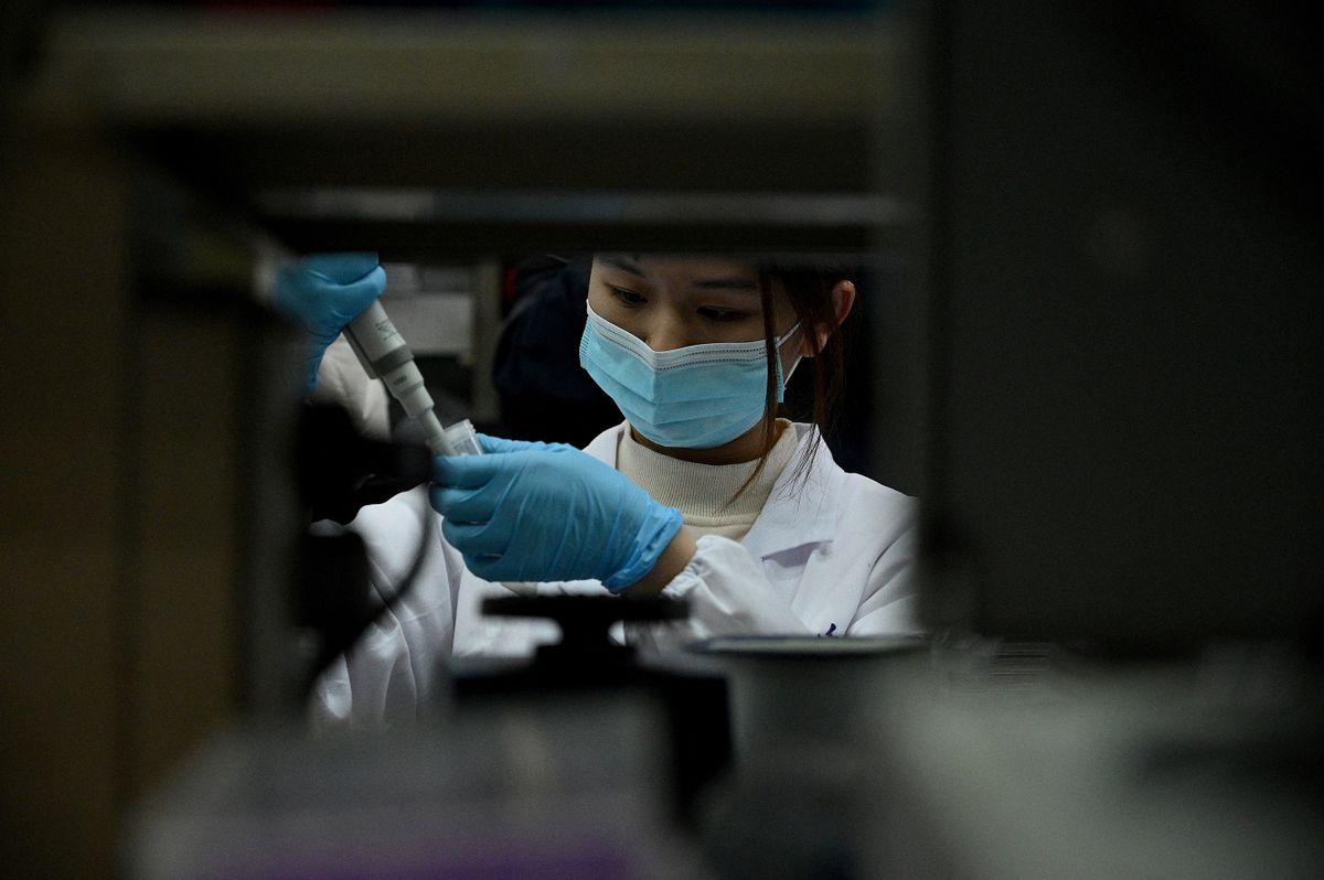 A laboratory technician works at a Tsinghua University lab in Beijing on December 9, 2021, which co-developed a monoclonal antibody treatment for Covid-19 with the Third People's Hospital of Shenzhen and Brii Biosciences and was granted emergency approval by China's drug authority on December 8.
