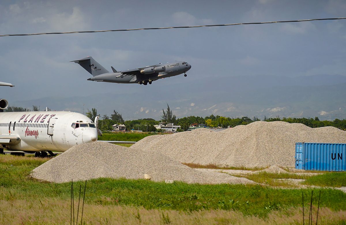 A Canadian military plane takes off from Toussaint Louverture International Airport in Port-au-Prince on October 15, 2022. - Canada is providing military personnel and security aid as Haiti faces a rise in gang violence. Haiti, the poorest nation in the Americas, is also facing an acute political, economic, security and health crisis which has paralyzed the country and sparked a breakdown of law and order. UN Secretary-General Antonio Guterres has called for the immediate deployment of a special armed force. 