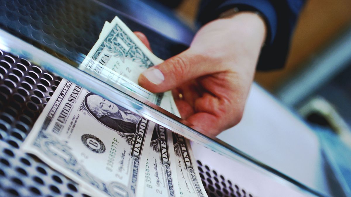HAND HOLDING THREE AMERICAN DOLLARS, dollar, money, cash, 