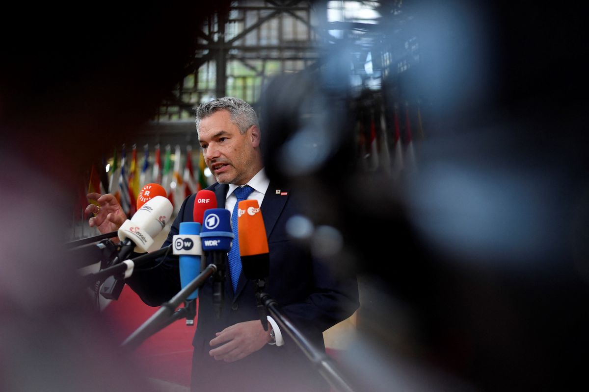 Austria's Federal Chancellor Karl Nehammer answers journalists' questions as he arrives for the first day of a EU leaders Summit at The European Council Building in Brussels on October 20, 2022. 