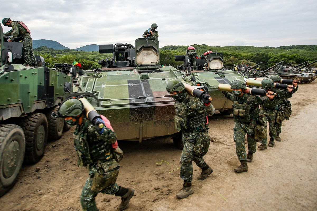 Taiwan Military Live-fire Training Amid Increasing Tensions With China, Taiwanese soldiers carrying artillery to tanks during the 2-day live-fire drill, amid intensifying threats military from China, in Pingtung county, Taiwan, 7 September 2022. Taipei has been receiving more arms sales and weapons from the US, while fostering its ties with countries like Japan, the UK, Canada and India, as Beijing vows to unify Taiwan without excluding the possibility of using force. (Photo by Ceng Shou Yi/NurPhoto) (Photo by Ceng Shou Yi / NurPhoto / NurPhoto via AFP)
