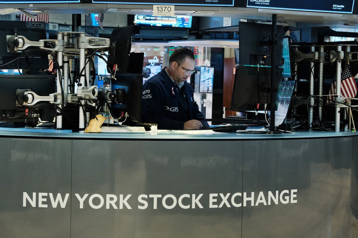 NEW YORK, NEW YORK - OCTOBER 14: Traders work on the floor of the New York Stock Exchange (NYSE) on October 14, 2022 in New York City. Following increased inflation concerns, the Dow Jones Industrial Average fell 403.89 points, or 1.34%, on Friday. 