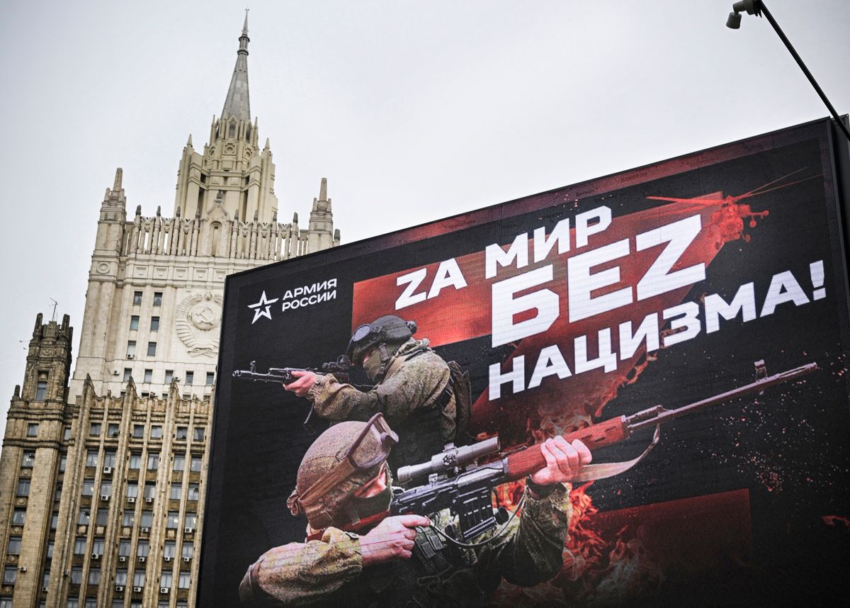 Russian Foreign Ministry building is seen behind a social advertisement billboard showing Z letters - a tactical insignia of Russian troops in Ukraine and reading "For the World without Nazism" in central Moscow on October 13, 2022. - Five Russians drafted to fight in Ukraine, as part of the "partial" mobilization ordered in September, died after joining the army, authorities said, as similar announcements have multiplied in recent days. (Photo by Alexander NEMENOV / AFP)