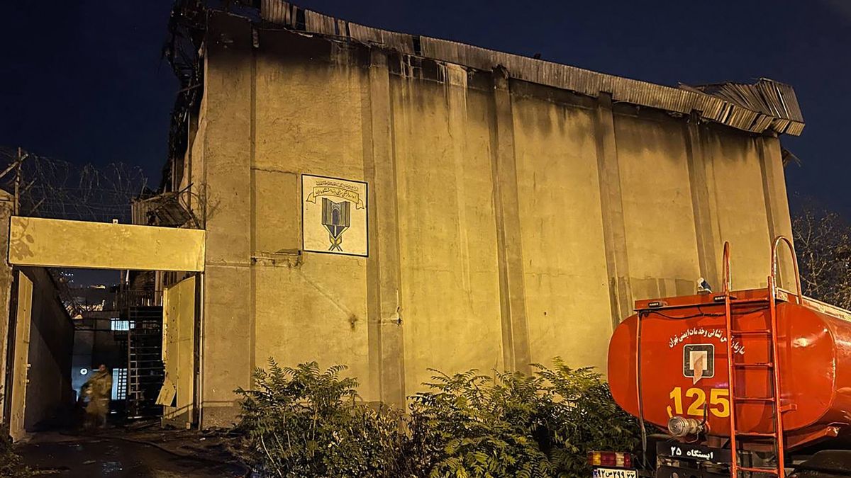 This image obtained from the Iranian news agency IRNA on October 16, 2022, shows a fire truck in front of the Evin prison, in the northwest of the Iranian capital Tehran. - The unrest at the prison came as Iran has been rocked by weeks of protests since Mahsa Amini's death on September 16, three days after she was arrested by morality police in Tehran for allegedly violating the country's strict dress code for women.