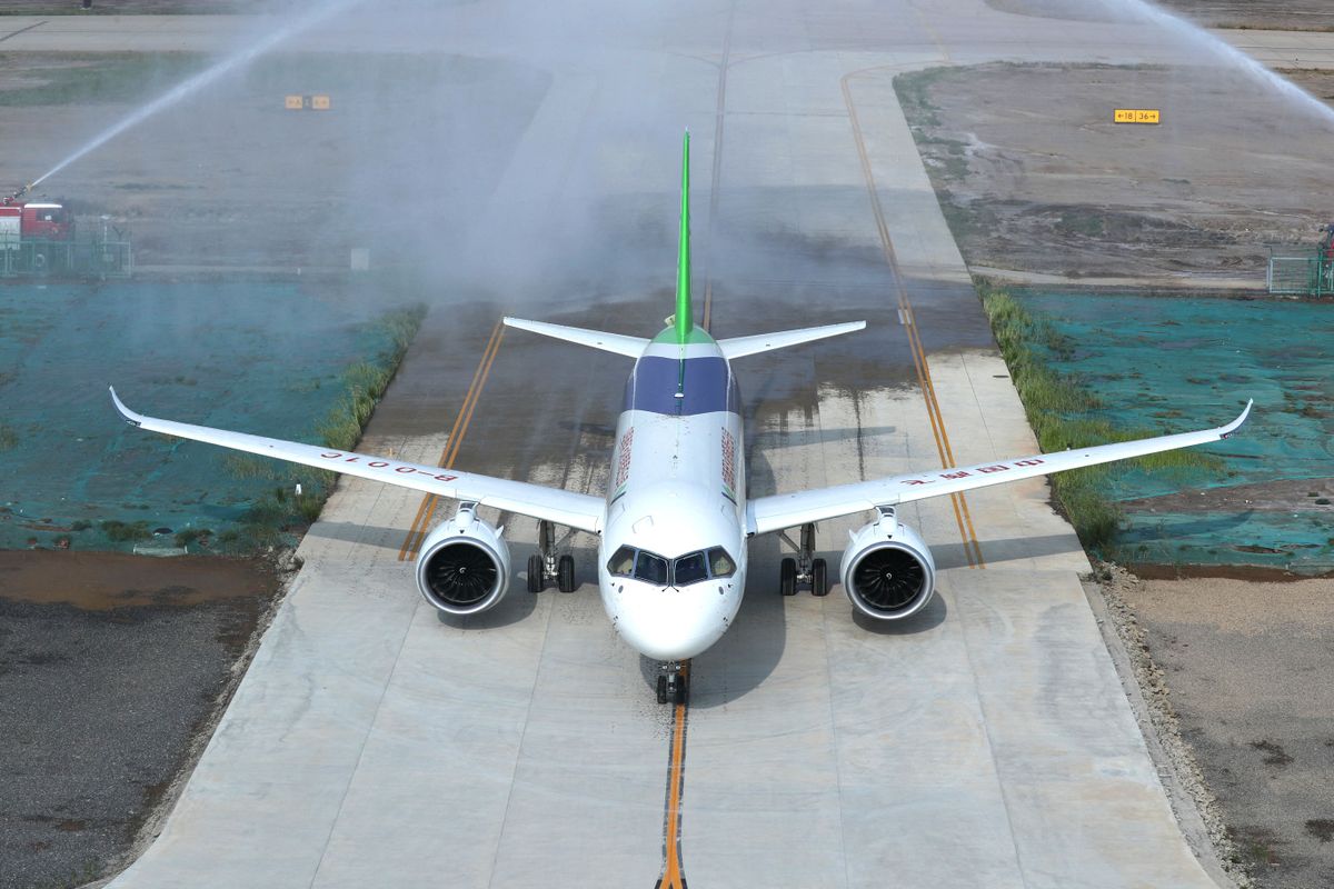 China's C919 project enters intensive flight test phase, China's second domestically-developed large passenger jet C919 of COMAC (Commercial Aircraft Corporation of China) lands at Dongying Shengli Airport in Dongying city, east China's Shandong province, 12 July 2018.China's C919 large passenger plane project has entered into a new major phase with intensive flight tests in multiple sites around the country, announced its developer the state-owned Commercial Aircraft Corp. of China (COMAC). The No.102 C919 plane landed at Dongying Shengli Airport in east China's Shandong Province Thursday, after its first long-distance flight from the final assembly line in Shanghai, COMAC said. Before this flight, the aircraft has completed multiple tests and had modifications made for the upcoming test missions. It will mainly undertake the ground tests of the aircraft's propulsion, fuel, and power supply systems, as well as environmental control. (Photo by Fei ji / Imaginechina / Imaginechina via AFP) PICTURES OF THE YEAR 2018 FROM IMAGINECHINA