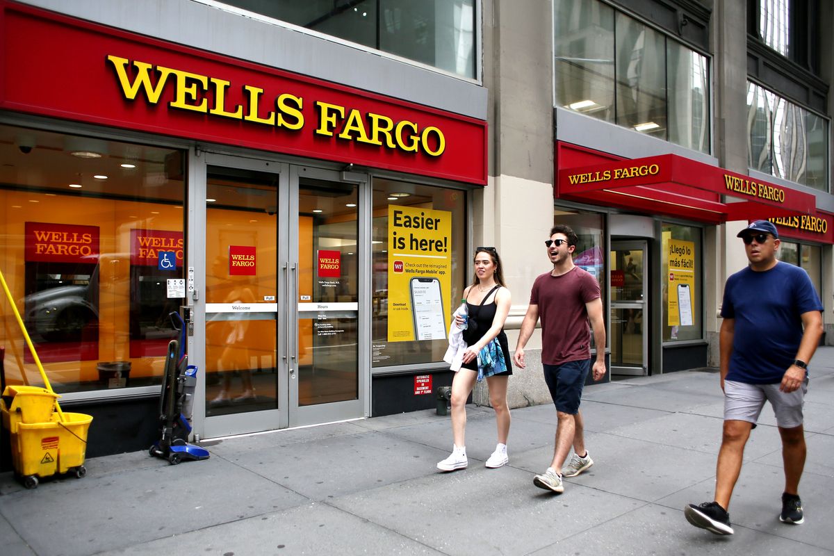 Wells Fargo Warning That a Recession is Imminent, NEW YORK, NEW YORK - JULY 08: People makes their way near a Wells Fargo Bank branch, on July 08, 2022 in New York. The Wells Fargo Investment Institute is now warning that a recession is imminet and expect it to last about a year. (Photo by John Smith/VIEWpress)