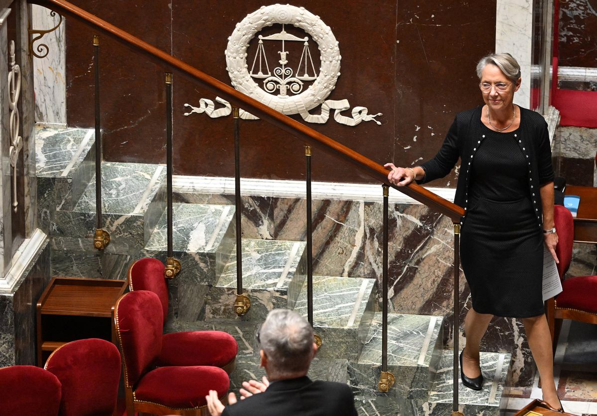 French Prime Minister Elisabeth Borne leaves the stand after addressing the National Assembly during the reading of the public finance programming bill 2023-2027, and the finance bill for 2023 at the "Assemblee Nationale" (National Assembly), in Paris on October 19, 2022. 