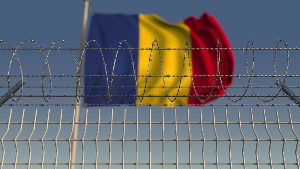 Defocused,Waving,Flag,Of,Romania,Behind,Barbed,Wire,Fence.,3d