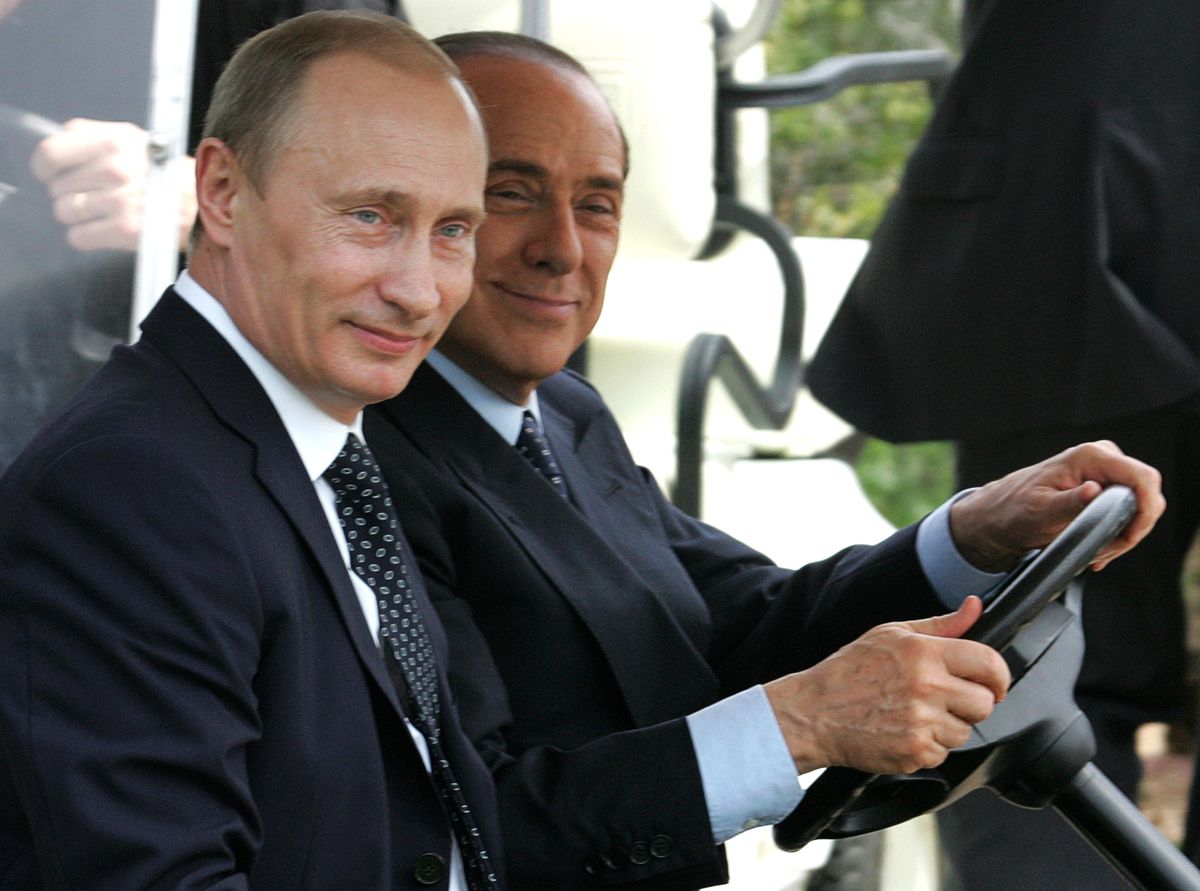 Vladimir Putin Meets With Silvio Berlusconi, PORTO ROTONDO, ITALY - APRIL 18:  Outgoing Russian President Vladimir Putin and Italian Prime Minister-elect Silvio Berlusconi (R) drive an electric buggy as they arrive to attend a joint press conference at Berlusconi's private summer residence villa 'La Certosa' on April 18, 2008 in Porto Rotondo, near Olbia, Italy. The meeting focused on developing bilateral relations with discussions on energy and the Italian Alitalia airline on the agenda.  (Photo by Artyom Korotayev/Epsilon/Getty Images)