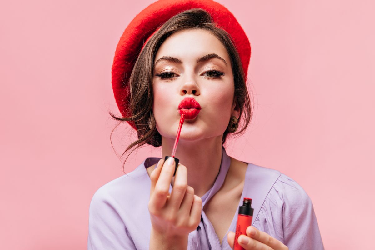 Portrait,Of,Young,Girl,In,Red,Beret,Painting,Her,Lips