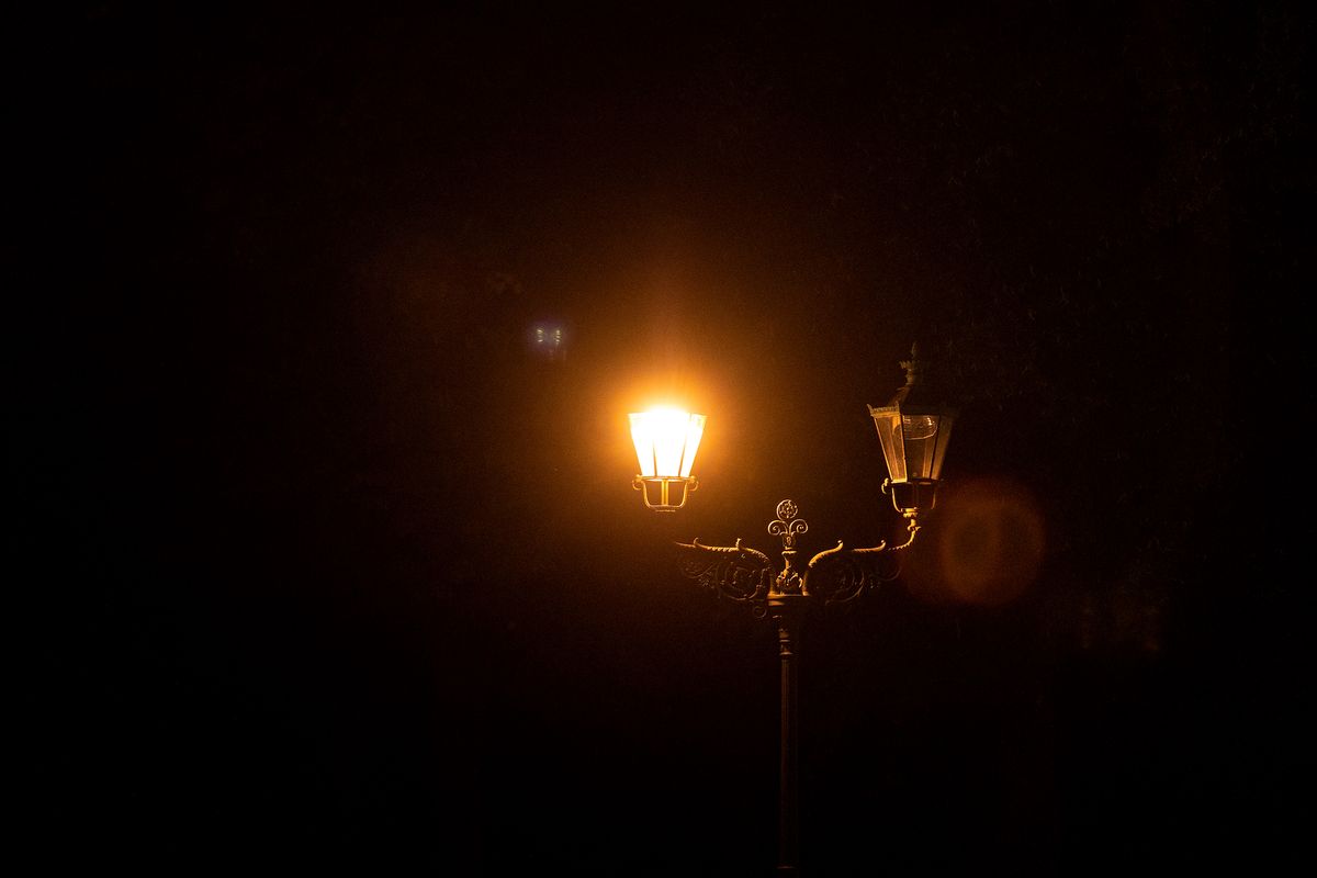 Berlin City Lighting as Chancellor Promises Germans More Relief to Endure Energy Crisis A lit street lamp near the Brandenburg Gate at night in Berlin, Germany, on Tuesday, Aug. 16, 2022. Germany's government has asked citizens, municipalities and industrial consumers to save energy, and efforts can be seen across the country. Photographer: Krisztian Bocsi/Bloomberg via Getty Images