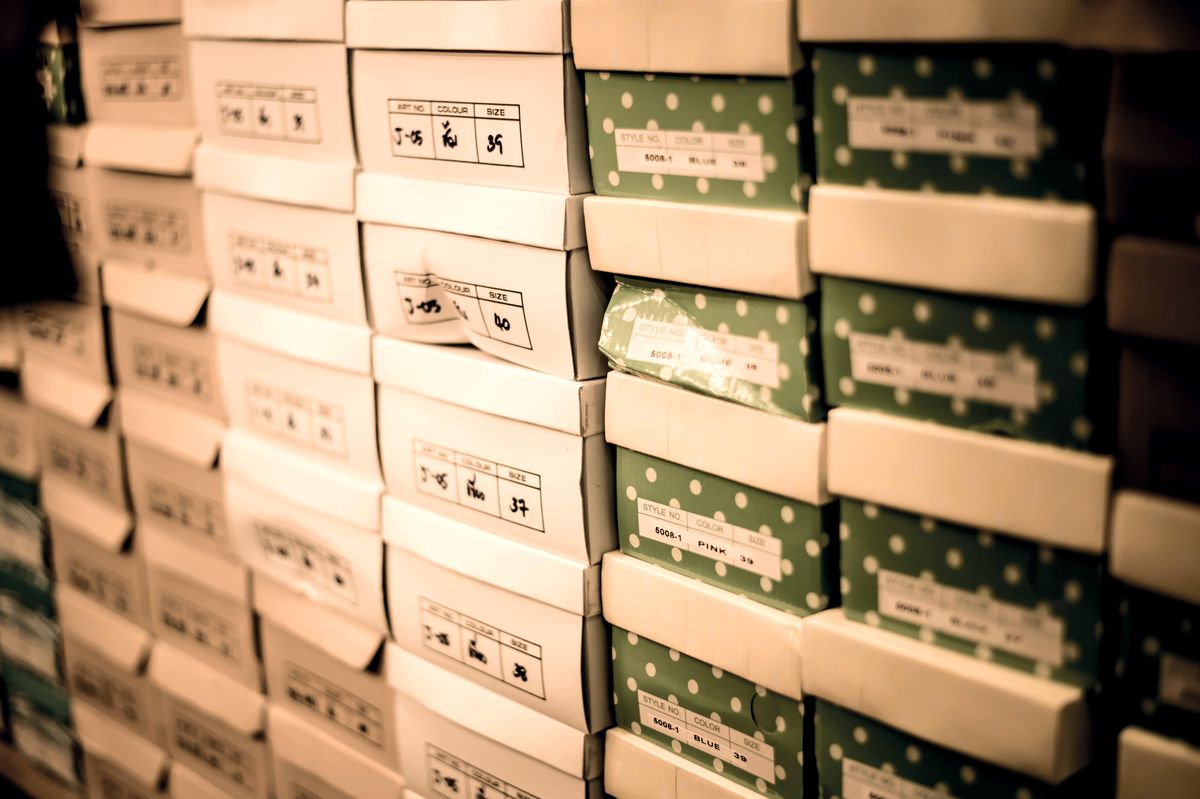 Row,Of,Shoes,Box,Stacked,In,Store.,Vintage,Filter. Row of shoes box stacked in store. Vintage filter. Row of shoes box stacked in store. Vintage filter.