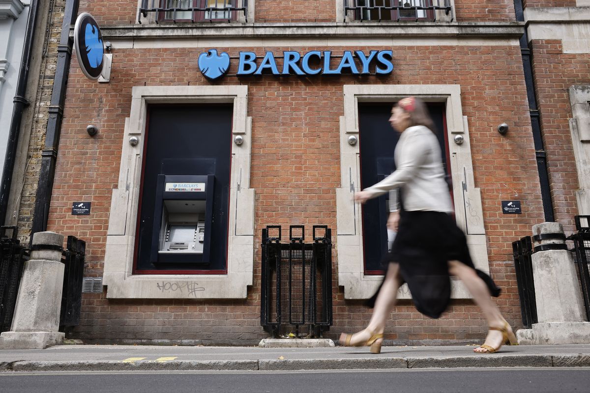 A pedestrian walks past a branch of British bank Barclays in central London on July 28, 2021. - British bank Barclays said Wednesday that first-half net profits surged on lower-than-expected credit losses, as the global economy shows signs of recovery from the pandemic. 