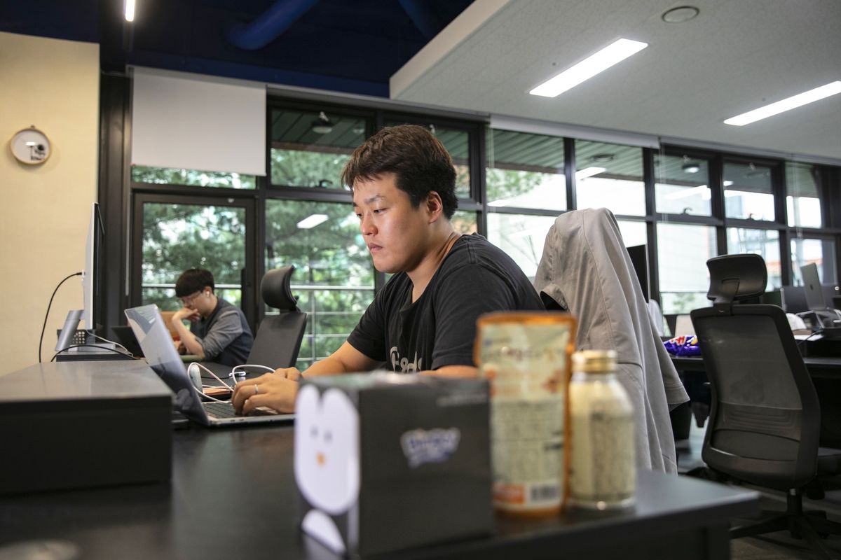 Terraform Labs Co-Founder Do Kwon , Do Kwon, co-founder and chief executive officer of Terraform Labs, works on his laptop in the company's office in Seoul, South Korea, on Thursday, April 14, 2022. Kwon is counting on the oldest cryptocurrency as a backstop for his stablecoin, which some critics liken to a ginormous Ponzi scheme. Photographer: Woohae Cho/Bloomberg via Getty Images