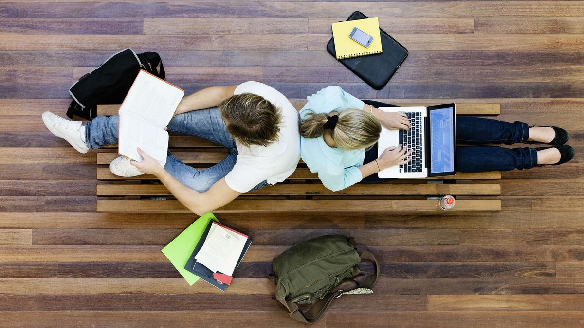 Top,View,Of,Male,And,Female,University,Students,Studying