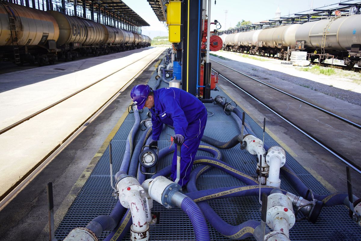 Inside Croatia's INA Industrija D.D Oil Refinery, A worker prepares to fill freight wagons with gasoline in the rail yard at the INA Industrija Nafte d.d. oil refinery in Urinj, Croatia, on Monday, July 18, 2022. The European Union last week gave its final approval for Croatia to join the euro zone early next year as the region looks to strike a delicate balance between bringing down inflation and sustaining output as the region risks a total cut off of Russian gas. Photographer: Oliver Bunic/Bloomberg via Getty Images, INA, croatia,