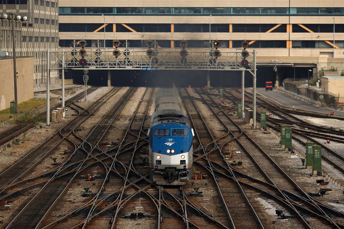 Inside Union Station As Amtrak Suspensions Are Threatened On Lawmakers Not Extending Safety Installations, An Amtrak passenger train navigates switches while departing from the south end of Union Station in Chicago, Illinois, U.S., on Wednesday, Oct. 7, 2015. The head of Amtrak warned Congress that some passenger rail service outside the Northeast corridor will be suspended if lawmakers don't extend a Dec. 31 deadline for railroads to install safety technology. Photographer: Luke Sharrett/Bloomberg via Getty Images