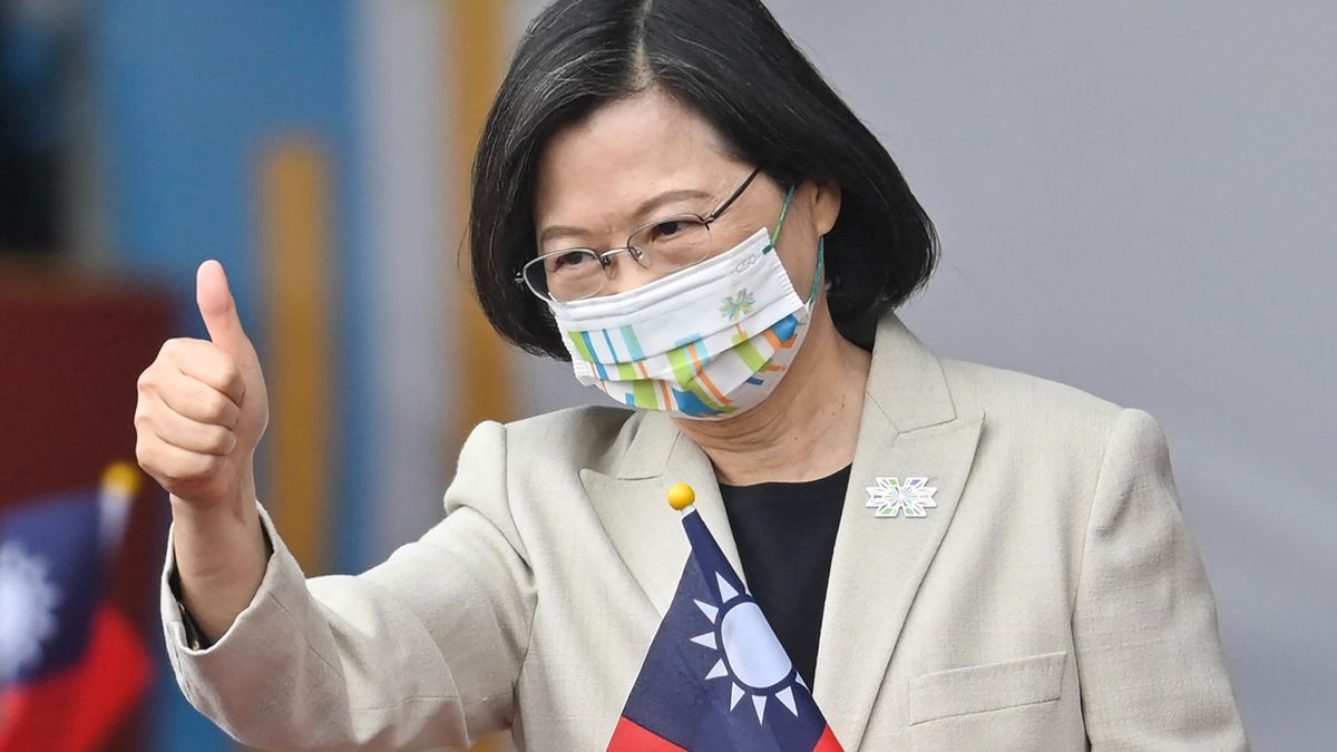 Taiwan's President Tsai Ing-wen gives a thumbs-up sign as she attends a ceremony to mark the island's National Day in front of the Presidential Office in Taipei on October 10, 2022. 