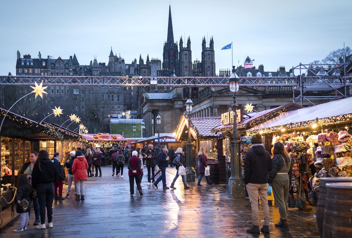 New Year's Eve, Shoppers at the Christmas Market on Edinburgh's Princes Street during New Year's Eve. Picture date: Friday December 31, 2021. (Photo by Jane Barlow/PA Images via Getty Images)