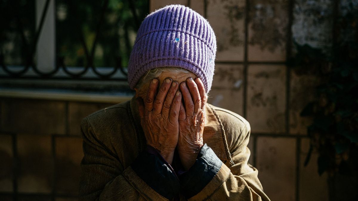 80 year-old Luba reacts during shelling in the town of Bakhmut on October 15, 2022, amid the Russian invasion of Ukraine. 