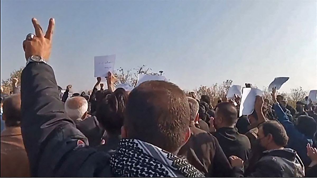 Video grabs from UGC images posted on October 26, show Iranian mourners marching towards Aichi cemetery in Saqez, Mahsa Amini's home town in the western Iranian province of Kurdistan, to mark 40 days since her death, defying heightened security measures as part of a bloody crackdown on women-led protests. - Amini, a 22-year-old Iranian of Kurdish origin, died on September 16, three days after her arrest by the notorious morality police while visiting Tehran with her younger brother. 