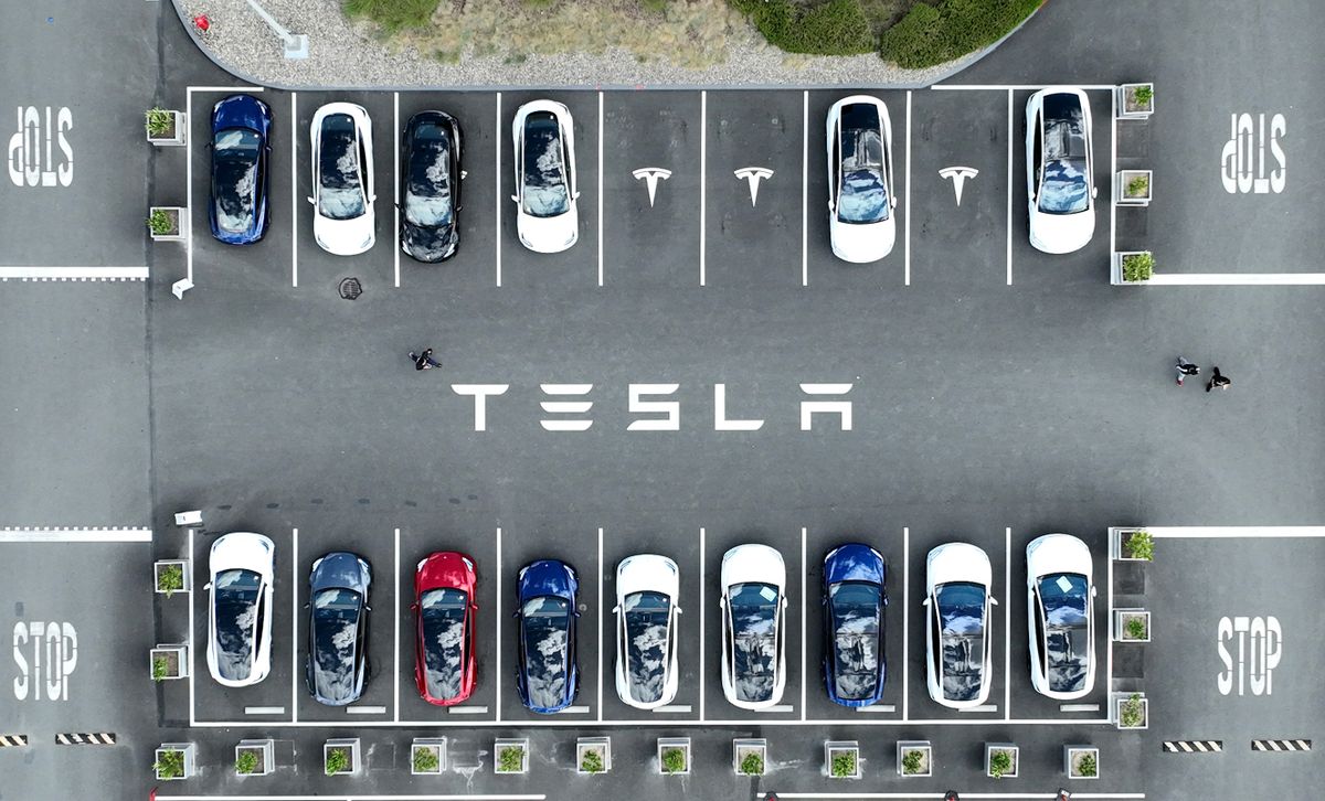 FREMONT, CALIFORNIA - APRIL 20: In an aerial view, Tesla cars sit parked in a lot at the Tesla factory on April 20, 2022 in Fremont, California. Tesla reported first quarter earnings that far exceeded analyst expectations with revenue of $18.76 billion compared to expectations of $17.80 billion. 