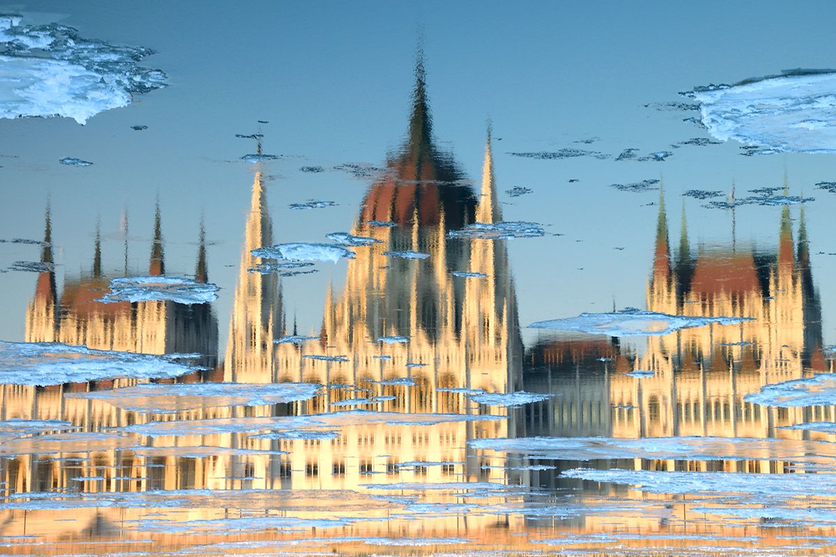 Reflection of the Hungarian Parliament Building in winter, Budapest, Hungary