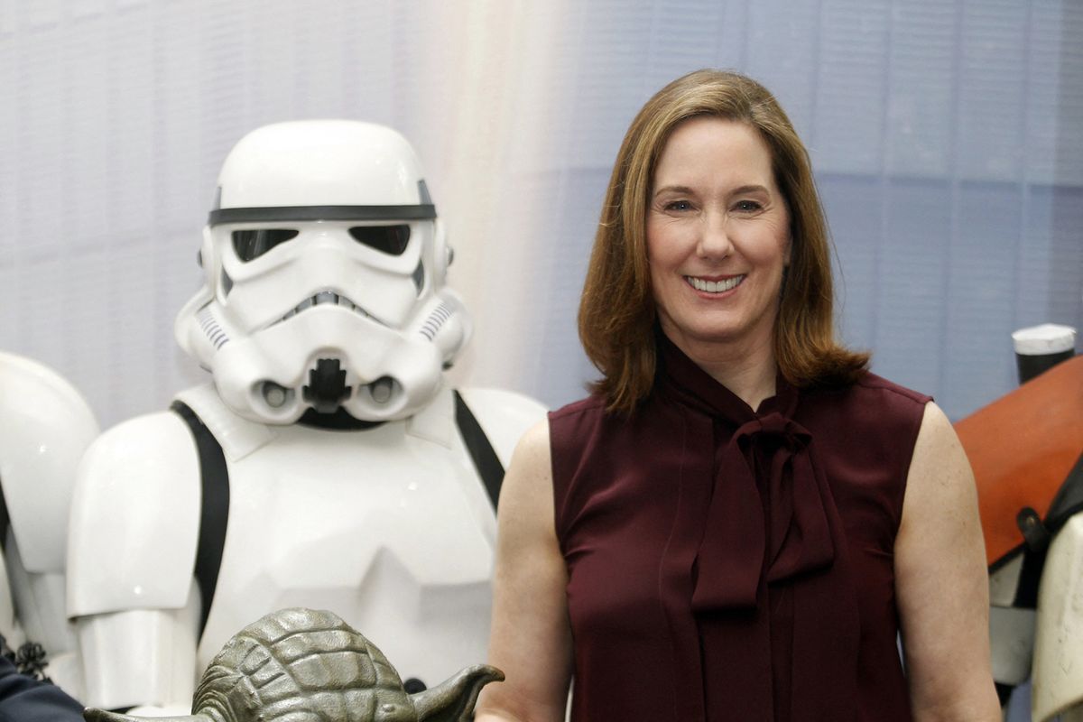 Lucasfilm president Kathleen Kennedy with a stormtrooper at the opening of the company’s new animation production facility, the Sandcrawler, in Singapore on 16 January 2014. (Photo by Kevin Lim / ST / Singapore Press Holdings via AFP)