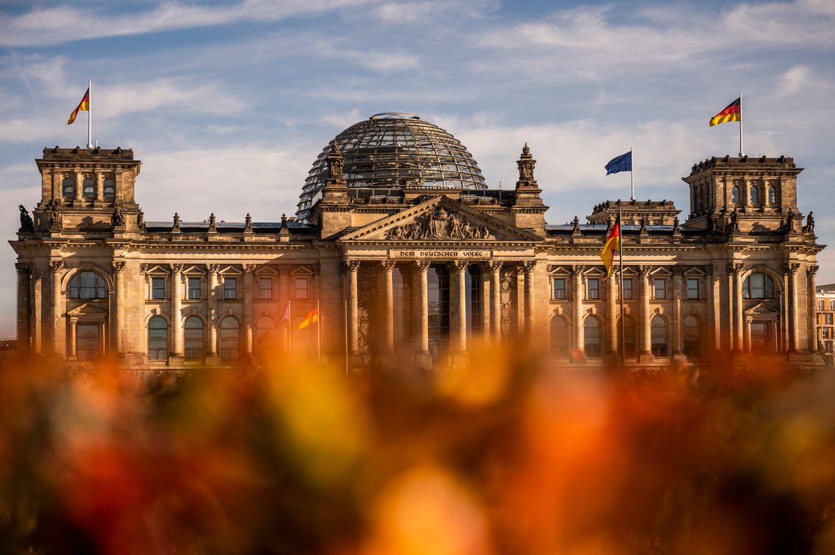 Reichstag building, 27 October 2022, Berlin: Colorful leaves lie on the lawn in front of the Reichstag building. Photo: Christophe Gateau/dpa/ZB (Photo by Christophe Gateau / Deutsche Presse-Agentur GmbH / dpa Picture-Alliance via AFP)