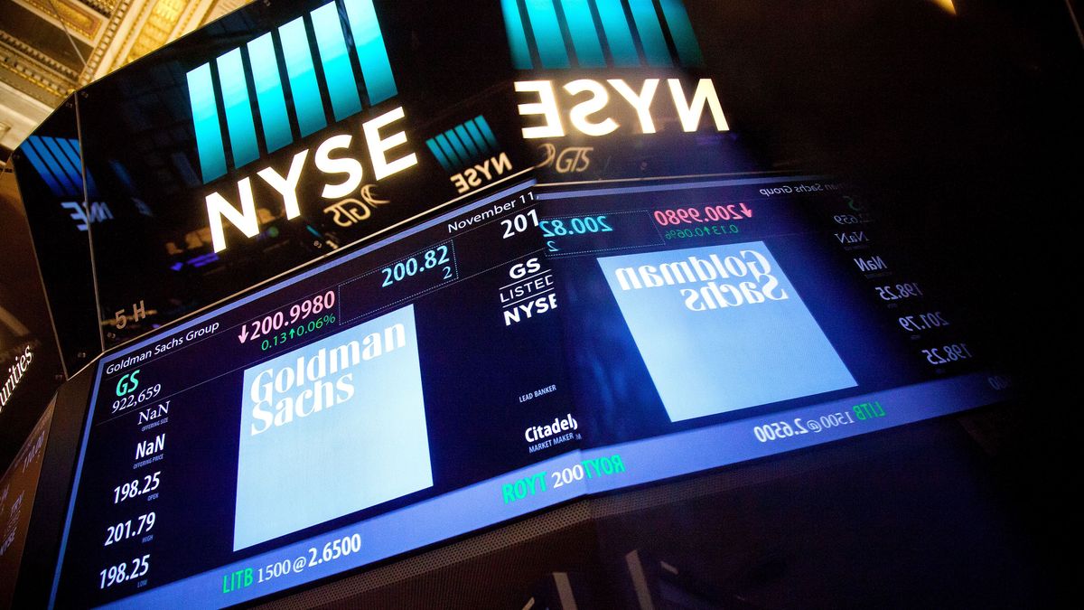 Trading On The Floor Of The NYSE As U.S. Stocks Pare Declines While Small Caps Fuel Election Rally, Goldman Sachs Group Inc., signage is displayed on the floor of the New York Stock Exchange (NYSE) in New York, U.S., on Friday, Nov. 11, 2016. U.S. stocks fluctuated in whipsaw trading, with the Dow Jones Industrial Average spinning near a record, as investors speculate how Donald Trump's policies will impact the economy and interest rates. Small caps headed for the best weekly gain in five years. Photographer: Michael Nagle/Bloomberg via Getty Images