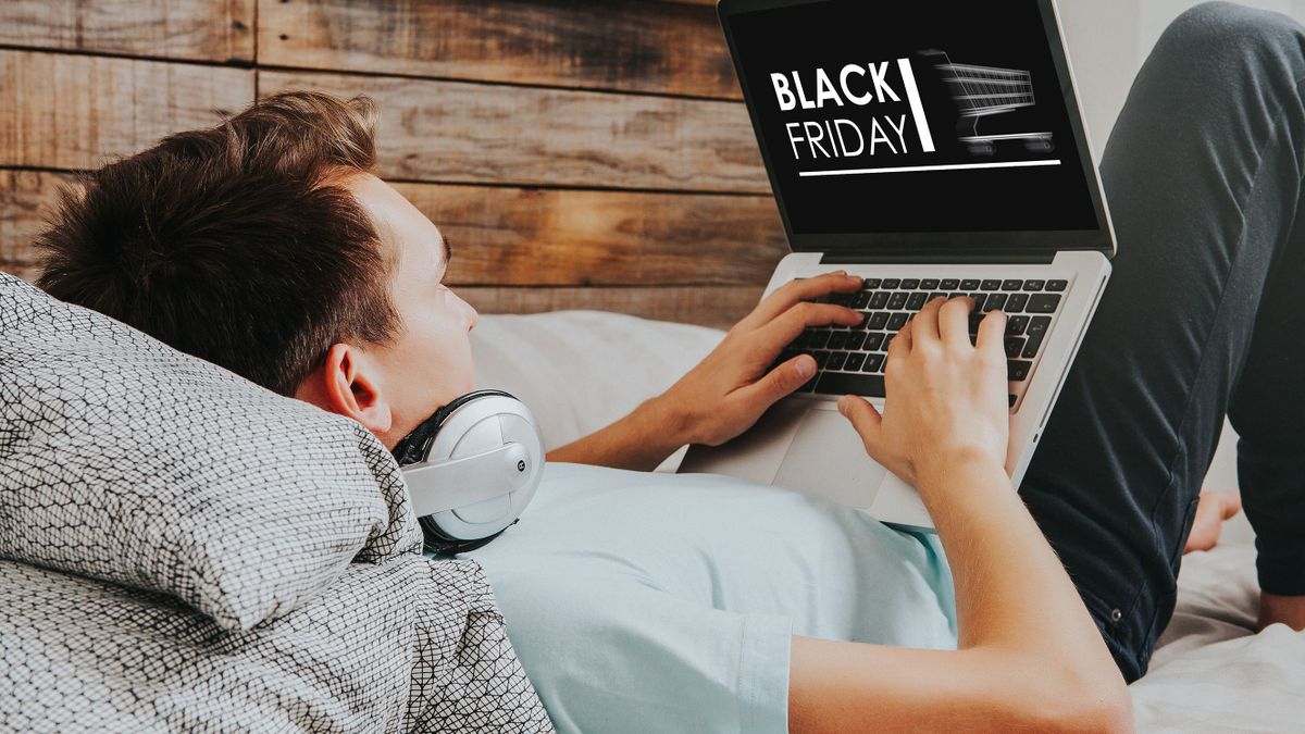 Black,Friday,Banner,In,A,Laptop,Computer,While,Man,Uses