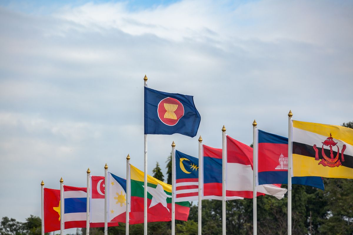 Asean,Economic,Community,Flags,,Southeast,Asia,Countries,And,Sky,Background