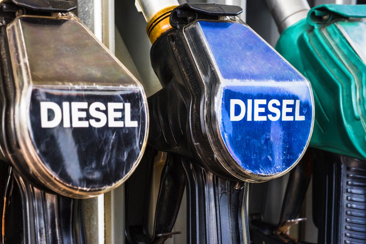 Diesel,Fuel,Pistols,On,A,Gas,Station,Refueling,Stand.,Detailed, Diesel fuel pistols on a gas station refueling stand. Detailed macro photo for oil business, truck, airplane and car transportation or ecological theme background