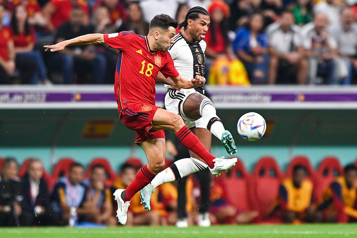 Spain v Germany: Group E - FIFA World Cup Qatar 2022 AL KHOR, QATAR - NOVEMBER 28: Jordi Alba of Spain battles for the ball with Serge Gnabry of Germany during the Group E - FIFA World Cup Qatar 2022 match between Spain and Germany at the Al Bayt Stadium on November 28, 2022 in Al Khor, Qatar (Photo by Pablo Morano/BSR Agency/Getty Images)