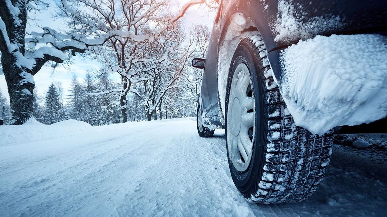 Car,Tires,On,Winter,Road,Covered,With,Snow