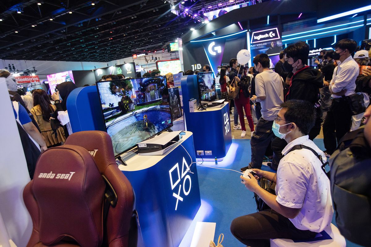 A visitor plays a video game on the Sony Playstation 5