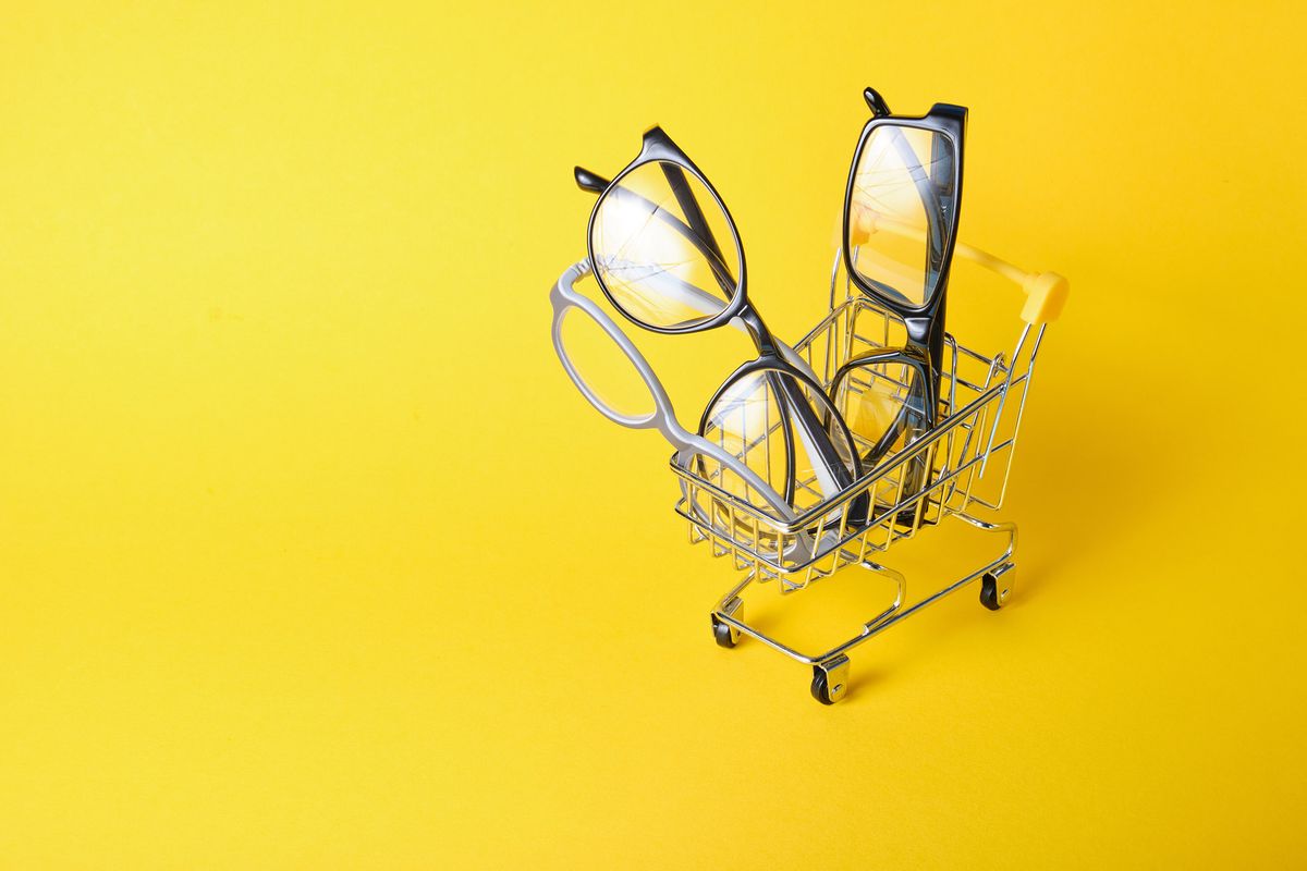 Eyeglasses,In,Shopping,Cart,On,Yellow,Background
