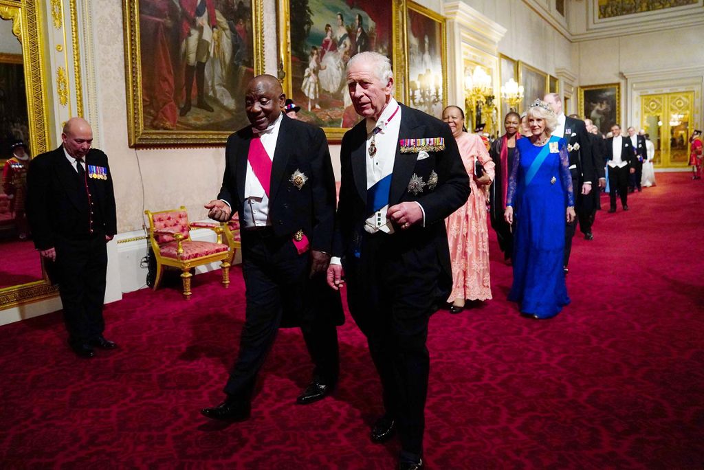 South Africa's President Cyril Ramaphosa (L), Britain's King Charles III, South Africa's Foreign Minister Naledi Pandor and Britain's Camilla, Queen Consort during a State Banquet at Buckingham Palace in London on November 22, 2022, at the start of the President's of South Africa's two-day state visit. - King Charles III hosted his first state visit as monarch on Tuesday, welcoming South Africa's President to Buckingham Palace. (Photo by Victoria Jones / POOL / AFP)