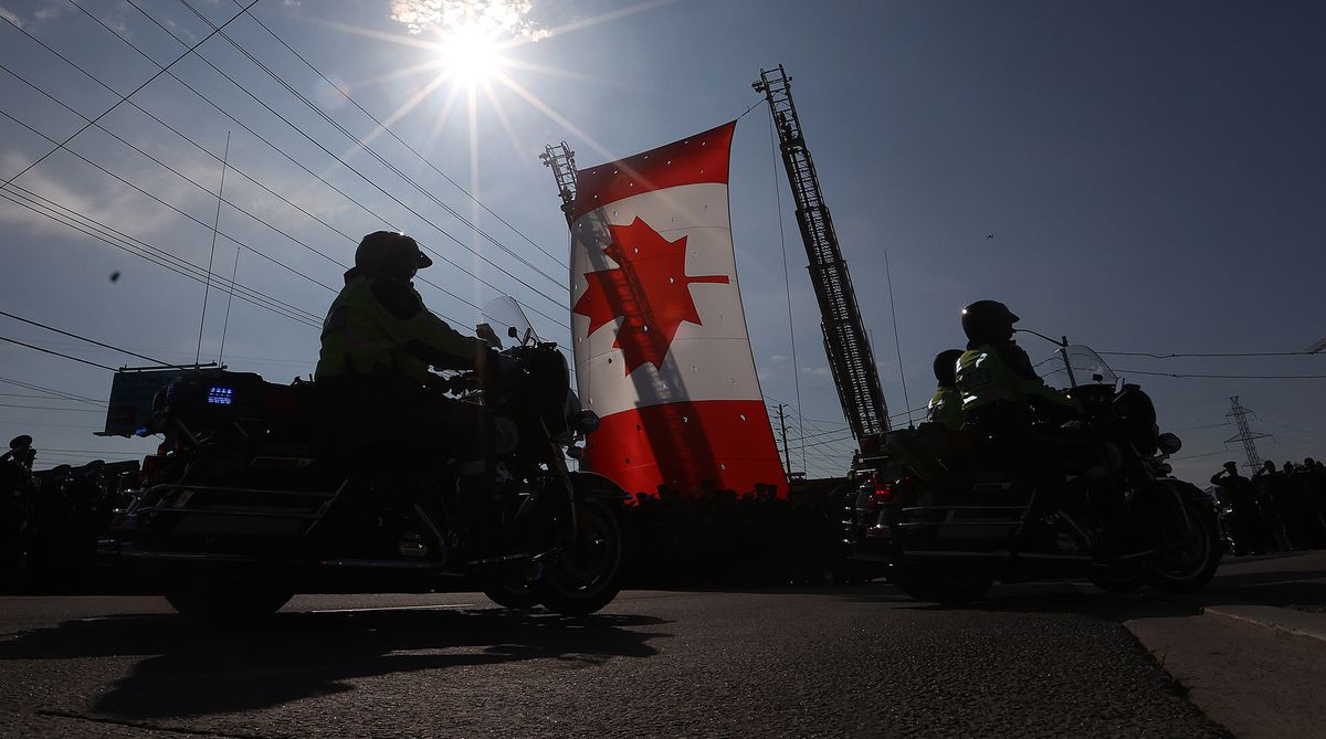 Toronto police Constable Andrew Hong is  laid to rest with a funeral at the Toronto Congress Centre, attended by thousands of police officers, emergency personnel, dignitaries and Hong's family and friends