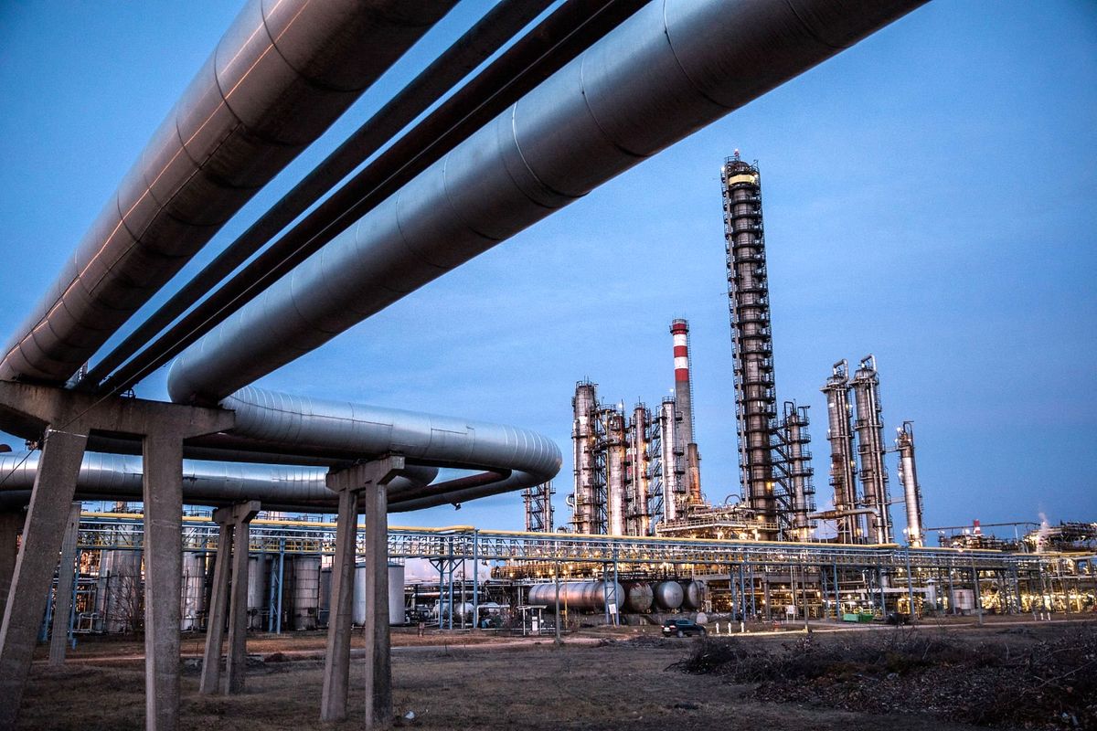 Worker,Inspects,Refining,Structures,At,The,Duna,Oil,Refinery,,Operated, Worker inspects refining structures at the Duna oil refinery, operated by MOL Hungarian Oil And Gas Plc
