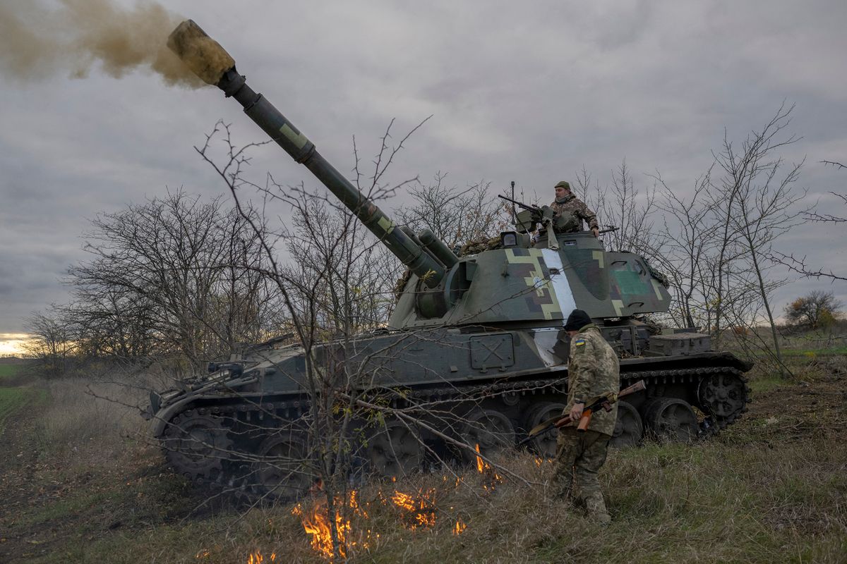 Ukrainian artillery unit members fire towards Kherson on October 28, 2022, outside of Kherson region, amid Russia's military invasion on Ukraine. 