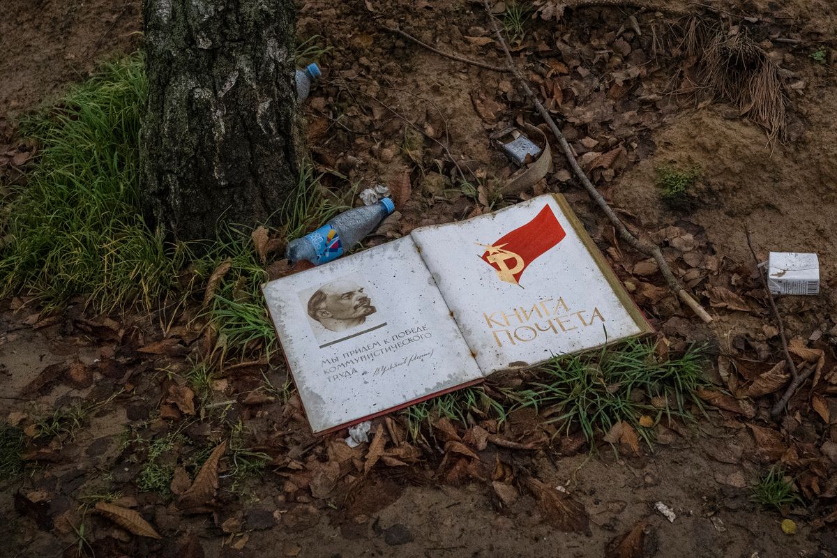 This photograph taken on November 20, 2022, shows a book containing a picture of Soviet Union founder Vladimir Lenin at the International Airport of Kherson in the village of Chornobaivka, outskirts of Kherson, amid the Russian invasion of Ukraine. 