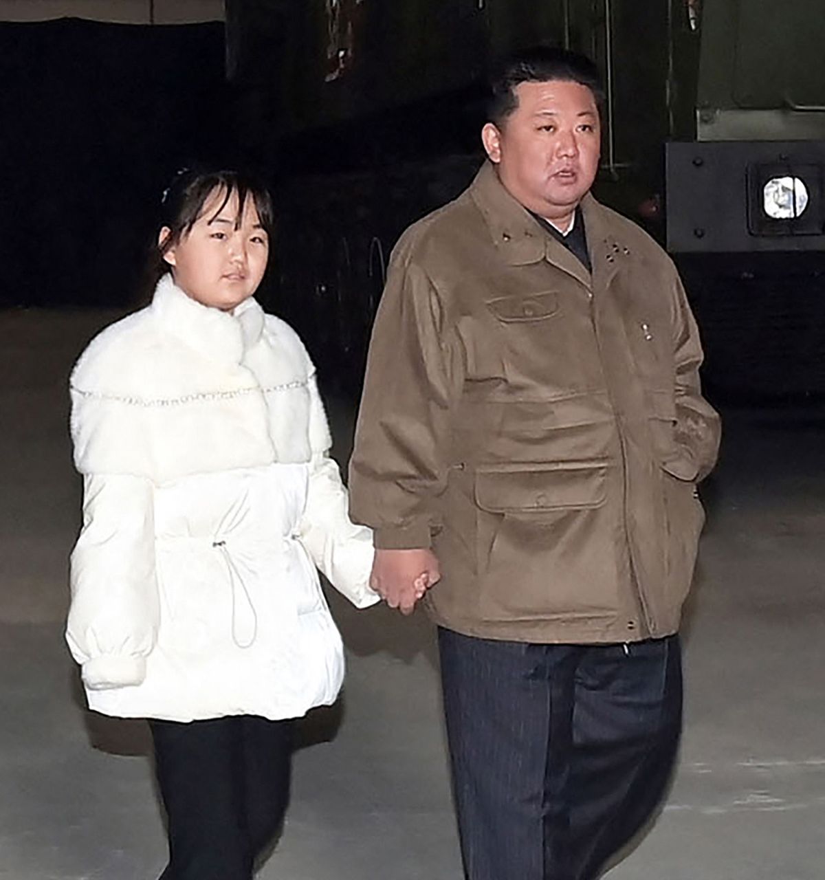 This picture taken on November 18, 2022 and released from North Korea's official Korean Central News Agency (KCNA) on November 19, 2022 shows North Korea's leader Kim Jong Un (R) walking with his daughter as he inspects a new intercontinental ballistic missile (ICBM) "Hwasong Gun 17", ahead of its launch at Pyongyang International Airport. - North Korean leader Kim Jong Un said he would respond to US threats with nuclear weapons, state media said on November 19, after Kim personally oversaw Pyongyang's latest launch of intercontinental ballistic missile. (Photo by KCNA VIA KNS / AFP) / South Korea OUT / REPUBLIC OF KOREA OUT---EDITORS NOTE--- RESTRICTED TO EDITORIAL USE - MANDATORY CREDIT "AFP PHOTO/KCNA VIA KNS" - NO MARKETING NO ADVERTISING CAMPAIGNS - DISTRIBUTED AS A SERVICE TO CLIENTS / THIS PICTURE WAS MADE AVAILABLE BY A THIRD PARTY. AFP CAN NOT INDEPENDENTLY VERIFY THE AUTHENTICITY, LOCATION, DATE AND CONTENT OF THIS IMAGE --- /